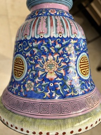 A large Chinese Canton enamel blue-ground 'shou' candlestick, Qianlong/Jiaqing