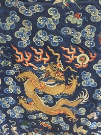 A Chinese gold thread embroidered blue-ground silk 'dragon' robe, 19th C.