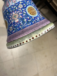 A large Chinese Canton enamel blue-ground 'shou' candlestick, Qianlong/Jiaqing