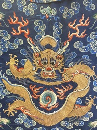 A Chinese gold thread embroidered blue-ground silk 'dragon' robe, 19th C.