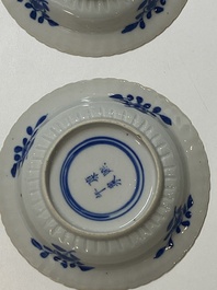 Five Chinese blue and white cups and four saucers with boys carrying a vase, Kangxi mark, Guangxu