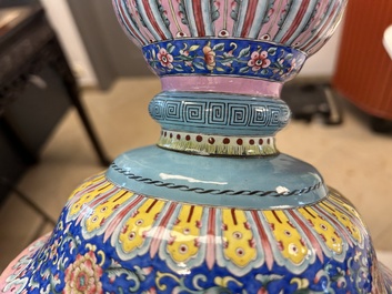 A large Chinese Canton enamel blue-ground 'shou' candlestick, Qianlong/Jiaqing