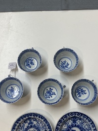 Five Chinese blue and white cups and four saucers with boys carrying a vase, Kangxi mark, Guangxu