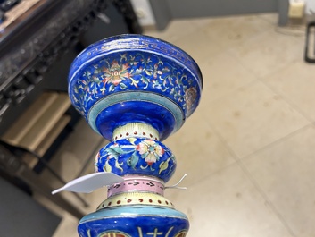 A large Chinese Canton enamel blue-ground 'shou' candlestick, Qianlong/Jiaqing