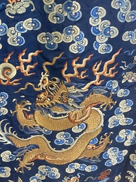 A Chinese gold thread embroidered blue-ground silk 'dragon' robe, 19th C.