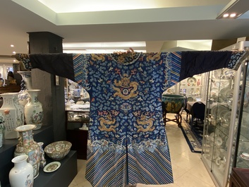 A Chinese gold thread embroidered blue-ground silk 'dragon' robe, 19th C.