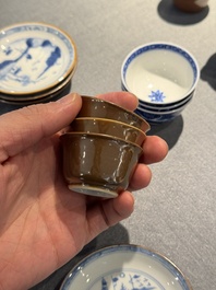 12 Chinese blue and white cups and 13 saucers, including capucin-brown glazed, Kangxi/Qianlong