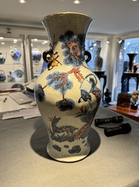 A Chinese blue, white and copper-red Nanking crackle-glazed vase, 19th C.