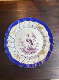 A gilt puce-enamelled 'birds' plate with a blue-enamelled border, Tournai, 18th C.