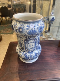 A large Italian blue, white and manganese albarello drug jar inscribed Charitas, probably Savona, dated 1767