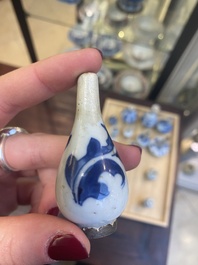Fourteen Chinese blue and white miniature vases with floral design, Kangxi