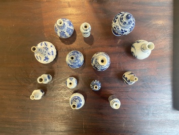 Fourteen Chinese blue and white miniature vases with floral design, Kangxi