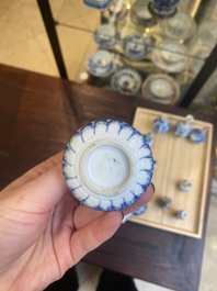 Fourteen Chinese blue and white miniature vases with floral design, Kangxi