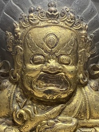 A Tibetan gilt copper 'Mahakala' plaque, 19th C.