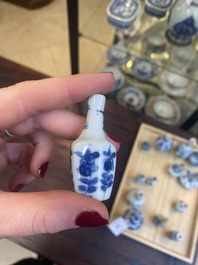 Fourteen Chinese blue and white miniature vases with floral design, Kangxi
