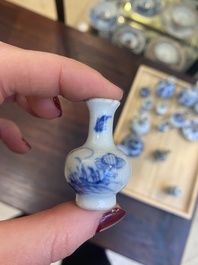 Fourteen Chinese blue and white miniature vases with floral design, Kangxi