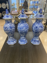 A Chinese blue and white garniture of five vases with floral design, Kangxi