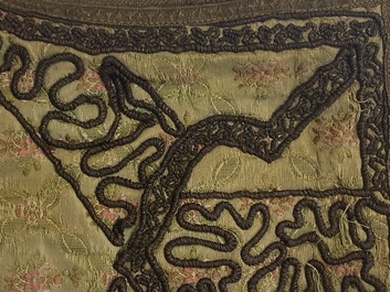 An Iranian gold-thread-embroidered silk caftan, a hat, a coin bracelet and a Koran holder, 19th C.