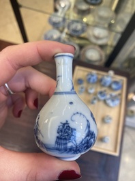 Fourteen Chinese blue and white miniature vases with floral design, Kangxi
