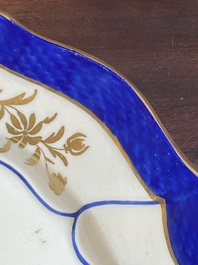 A gilt puce-enamelled 'birds' plate with a blue-enamelled border, Tournai, 18th C.