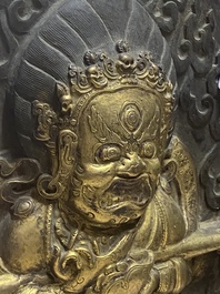 A Tibetan gilt copper 'Mahakala' plaque, 19th C.