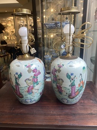 A pair of Chinese famille rose 'Eight Immortals' jars mounted as lamps, 19th C.