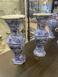 A Chinese blue and white garniture of five vases with floral design, Kangxi