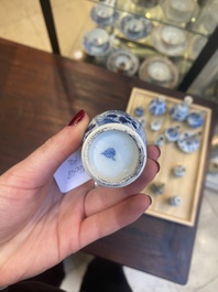 Fourteen Chinese blue and white miniature vases with floral design, Kangxi