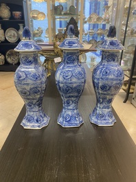 A Chinese blue and white garniture of five vases with floral design, Kangxi
