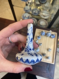 Fourteen Chinese blue and white miniature vases with floral design, Kangxi