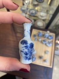 Fourteen Chinese blue and white miniature vases with floral design, Kangxi