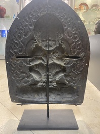A Tibetan gilt copper 'Mahakala' plaque, 19th C.