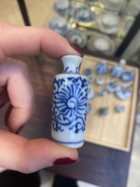 Fourteen Chinese blue and white miniature vases with floral design, Kangxi