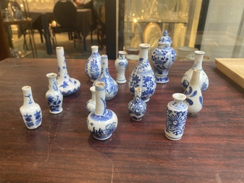 Fourteen Chinese blue and white miniature vases with floral design, Kangxi