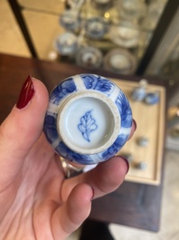 Fourteen Chinese blue and white miniature vases with floral design, Kangxi