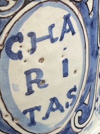 A large Italian blue, white and manganese albarello drug jar inscribed Charitas, probably Savona, dated 1767