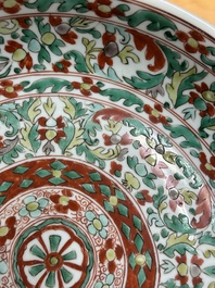 A Chinese wucai dish with stylized floral design, Kangxi