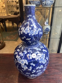 A Chinese blue and white double gourd 'prunus on cracked ice' vase, 18th C.