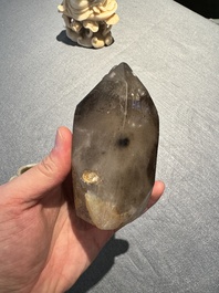 A Chinese soapstone and a crystal figures of Guanyin and a jade 'chilong' plaque, 19th C.