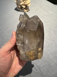 A Chinese soapstone and a crystal figures of Guanyin and a jade 'chilong' plaque, 19th C.