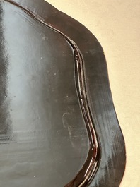 A large Chinese Canton gilt black lacquer tray, thee boxes and a fan, 19th C.