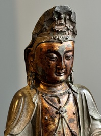 A fine Chinese partly lacquered and gilt bronze sculpture of Bodhisattva on lotus throne, Ming