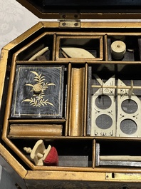 A large Chinese Canton gilt black lacquer tray, thee boxes and a fan, 19th C.