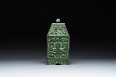 A rare large and inscribed archaistic bronze wine vessel, 'fang yi 方彝', Song/Ming