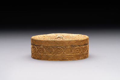 An oval Chinese imperial gold and silver filigree lidded 'dragon' box on reticulated stand and with presentation box, Qianlong mark and of the period
