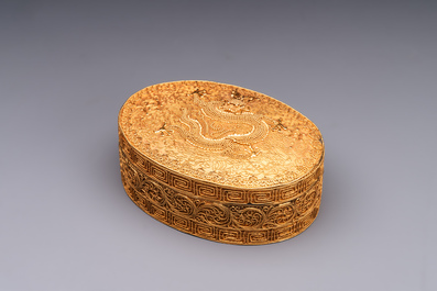 An oval Chinese imperial gold and silver filigree lidded 'dragon' box on reticulated stand and with presentation box, Qianlong mark and of the period