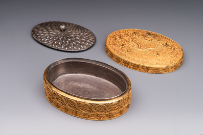 An oval Chinese imperial gold and silver filigree lidded 'dragon' box on reticulated stand and with presentation box, Qianlong mark and of the period