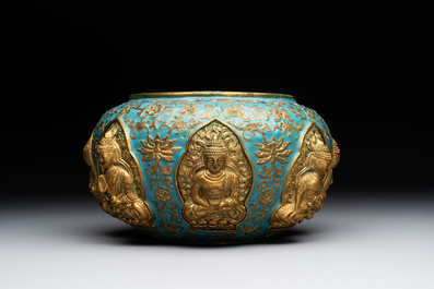 A Chinese gilt and champlev&eacute; enamelled bronze bowl with Buddhas in relief, 19/20th C.
