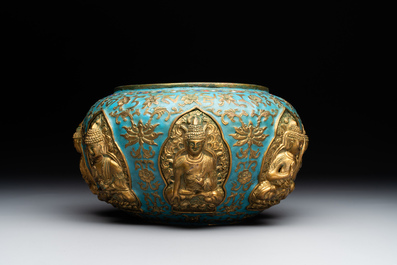 A Chinese gilt and champlev&eacute; enamelled bronze bowl with Buddhas in relief, 19/20th C.