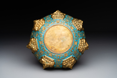 A Chinese gilt and champlev&eacute; enamelled bronze bowl with Buddhas in relief, 19/20th C.